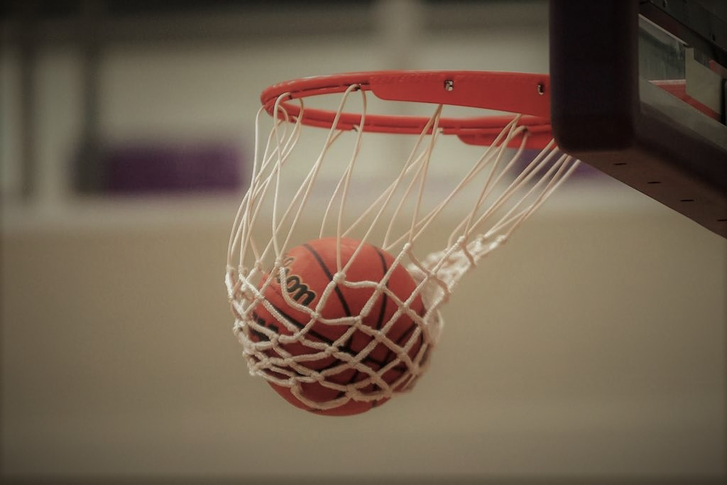 Basketball hoop with a ball swishing