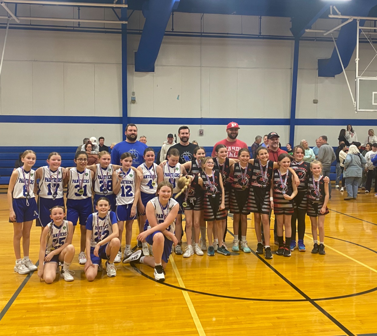 Female high school basketball player shooting basket