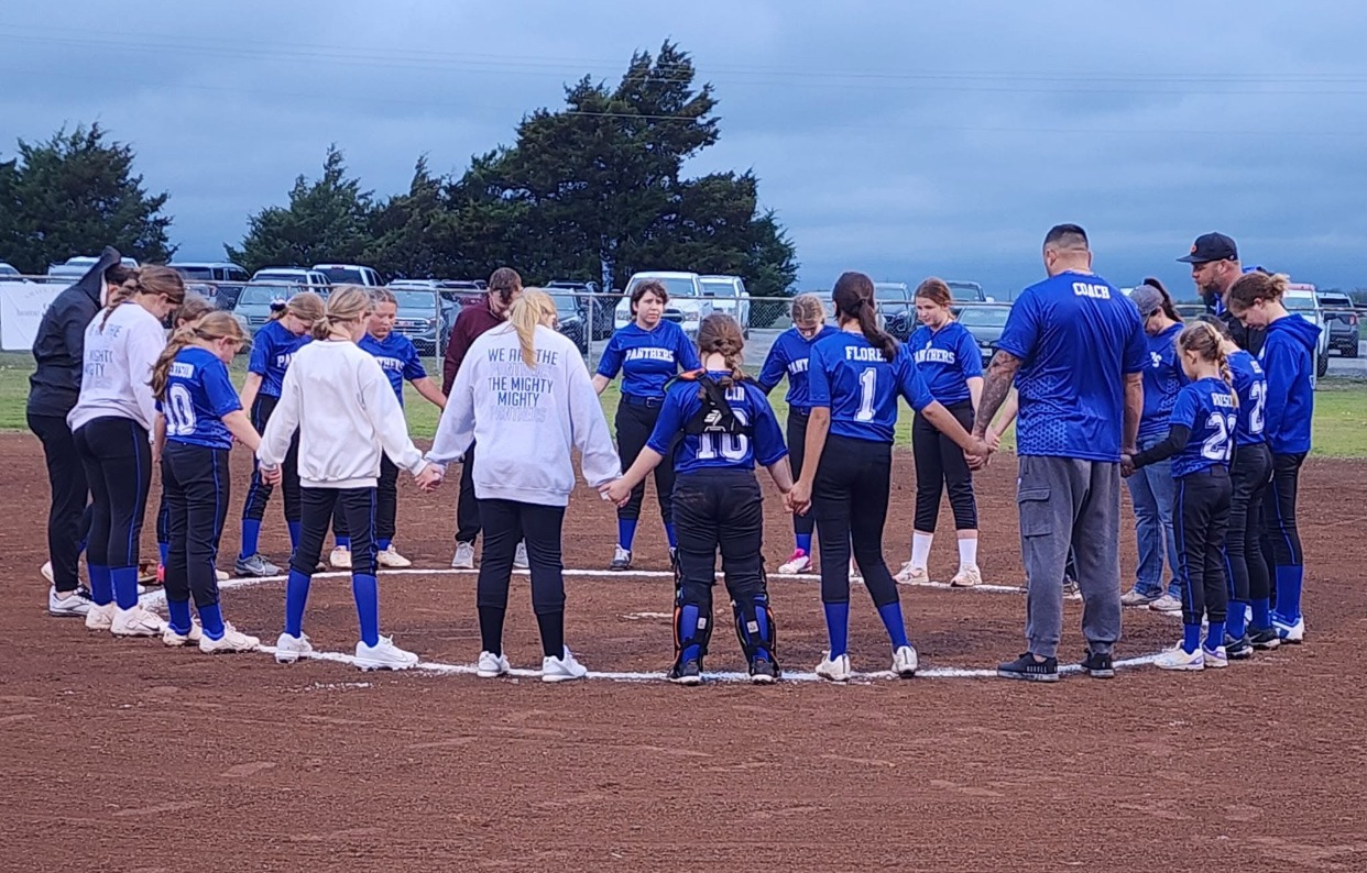Female high school basketball player shooting basket
