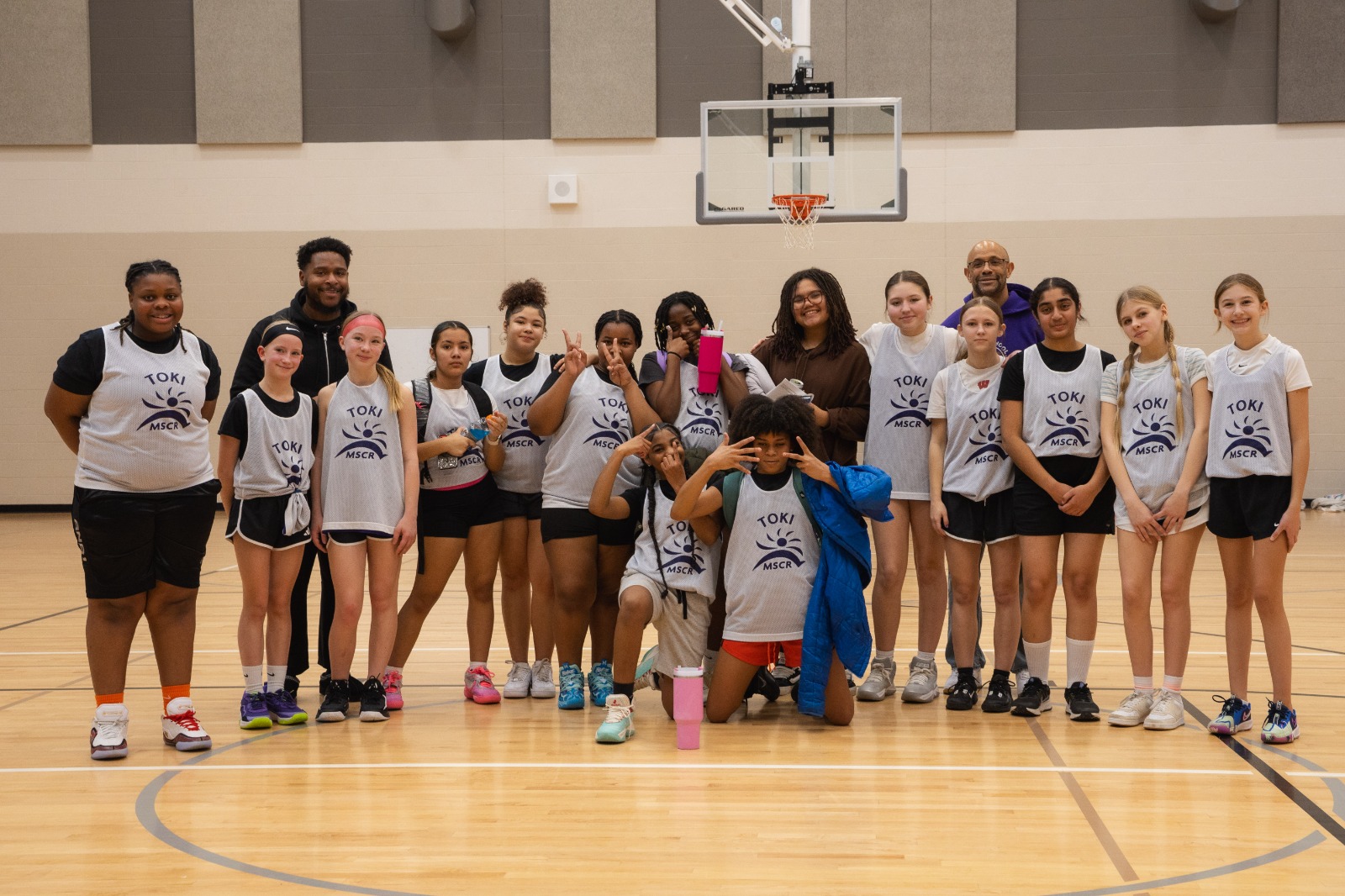Female high school basketball team playing game