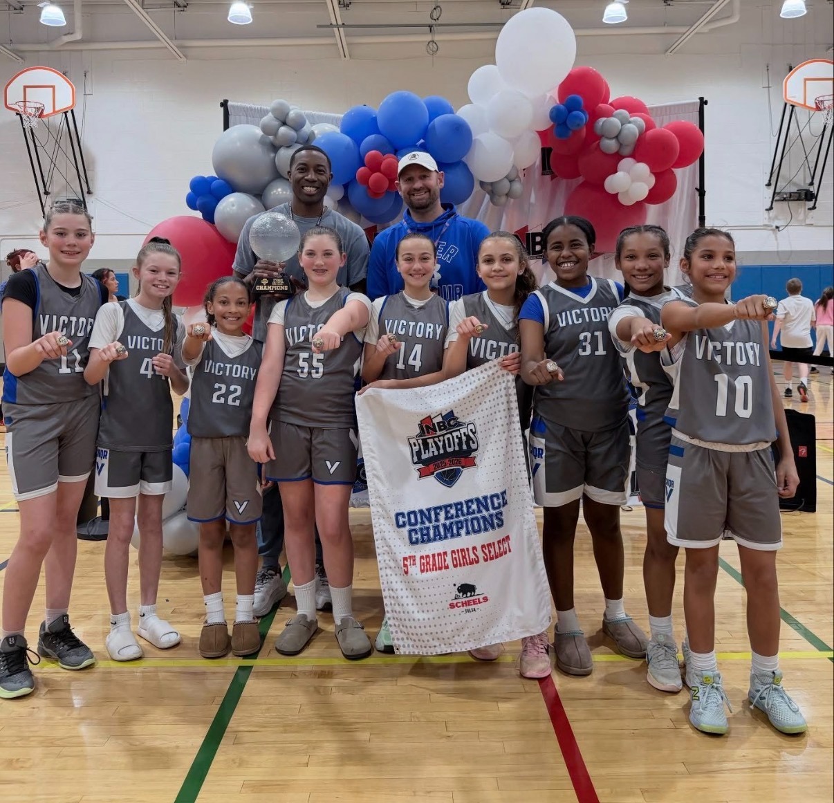 Female high school basketball team playing game