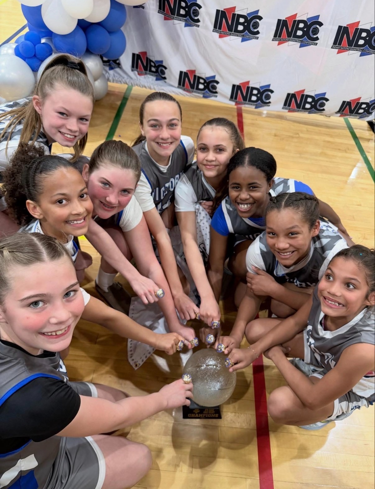 Female high school basketball player shooting basket